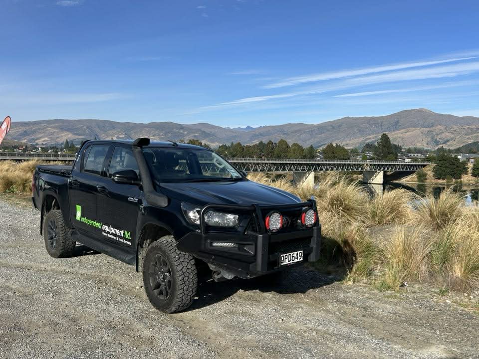 Independent Equipment company vehicle parked beside the Clutha River in Central Otago, New Zealand